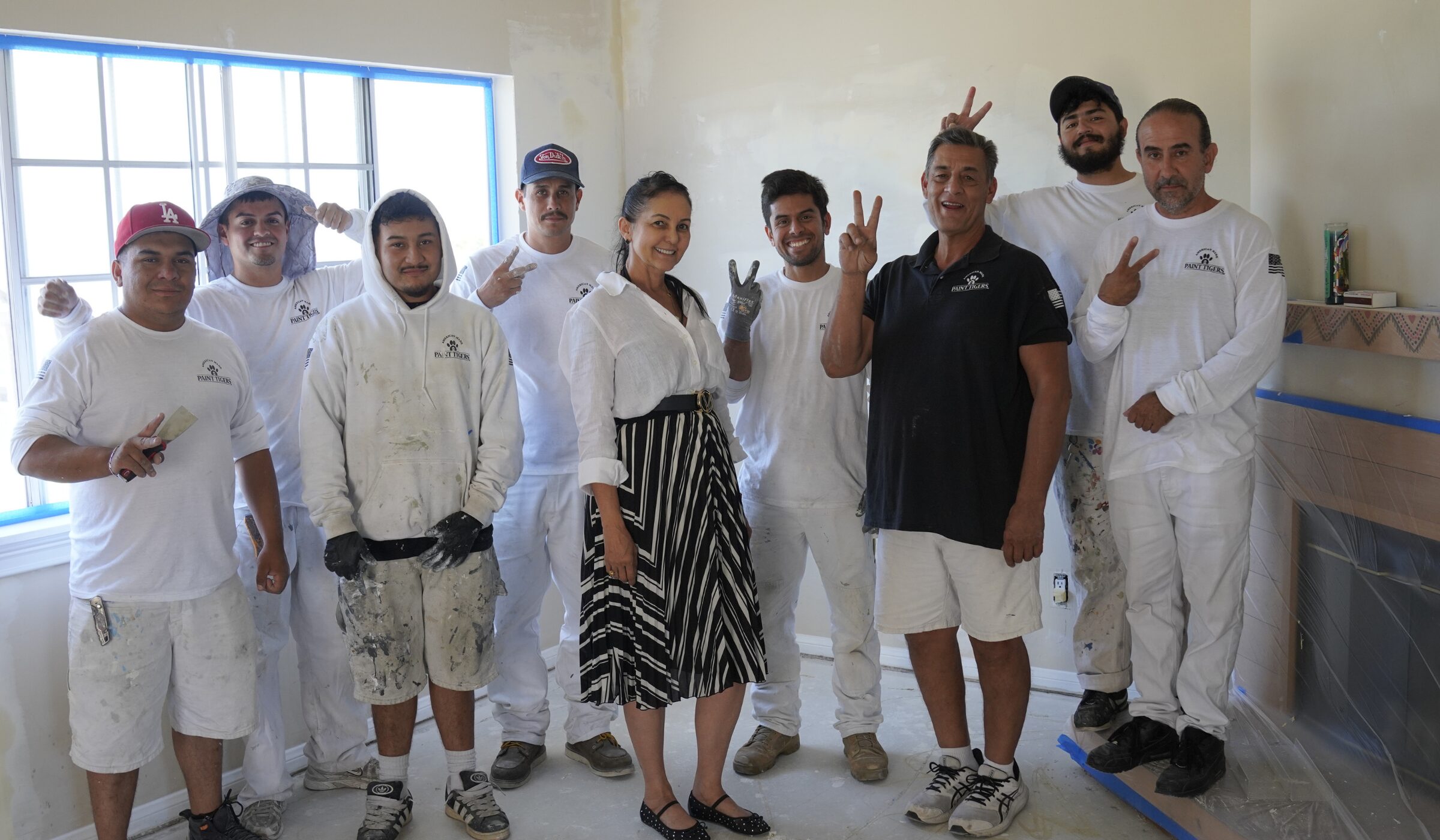 Paint Tigers owner and crew inside a Plano home