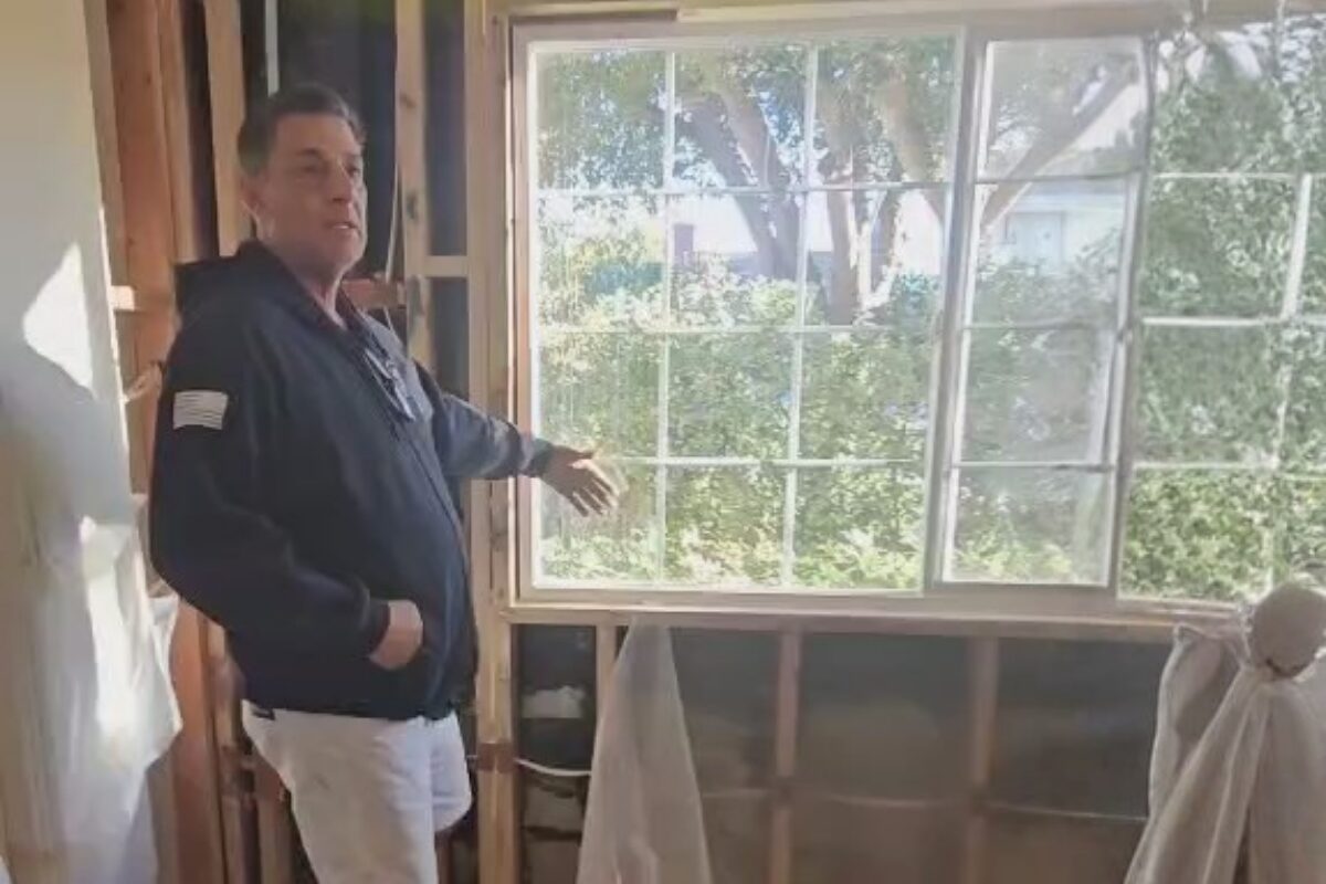 Ron inspecting a window frame before quoting