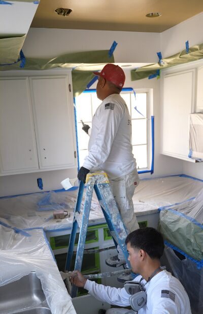 Kitchen fully masked and covered before a Paint Tigers repaint
